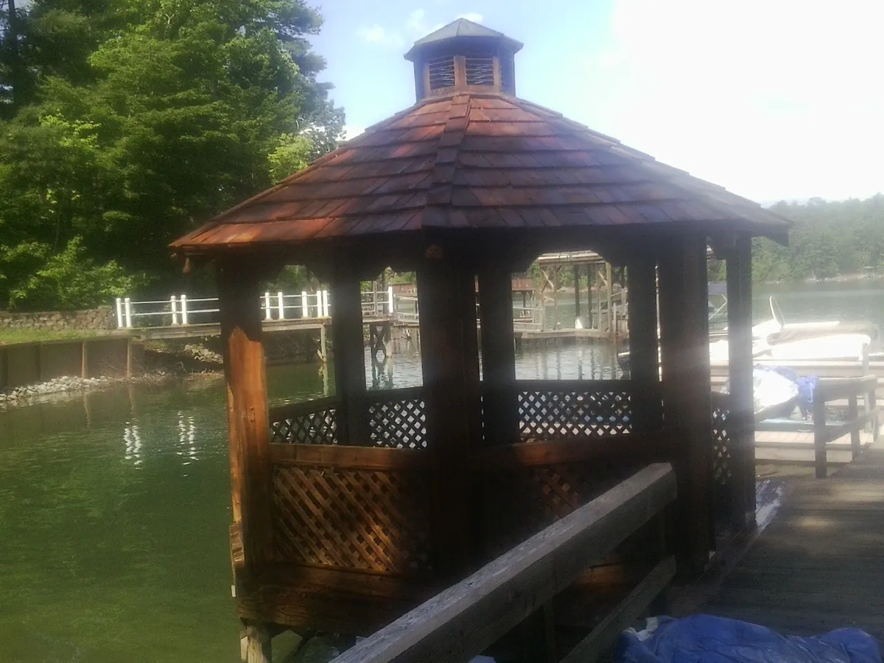 Cedar shake gazebo roof rebuilt on a lake dock in Hendrix